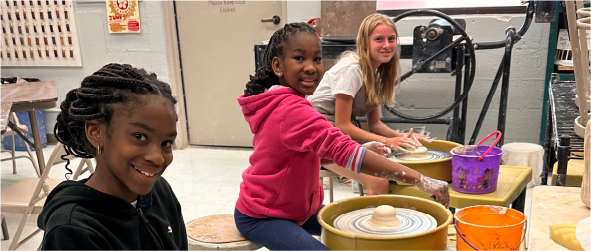 Kids making pottery