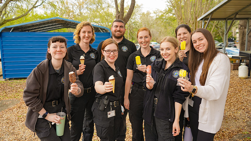 A group of TPD support personnel with frozen treats